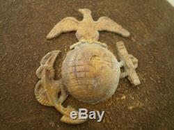Original U. S. WW1 M1917 helmet, ZB69 with original WW1 USMC badge