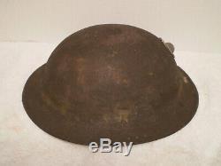 Original U. S. WW1 M1917 helmet, ZB69 with original WW1 USMC badge