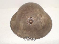 Original U. S. WW1 M1917 helmet, stamped ZD199 with Orig. USMC badge