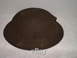 Original U. S. WW1 M1917 helmet with original WW1 USMC badge