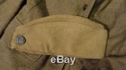 RARE WW1 NAMED U S SOLIDER GROUPING-HELMET, TUNIC, OVERCOAT, GAS MASK, CAP, PAPERS