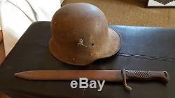 WW1 German helmet and butcher bayonet basement find