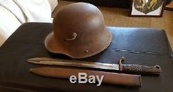 WW1 German helmet and butcher bayonet basement find