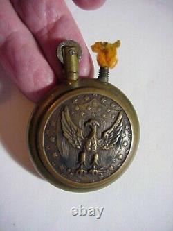 WWI BRASS TRENCH LIGHTER Round with Embossed SHIELD EAGLE & CANNON & FLAG